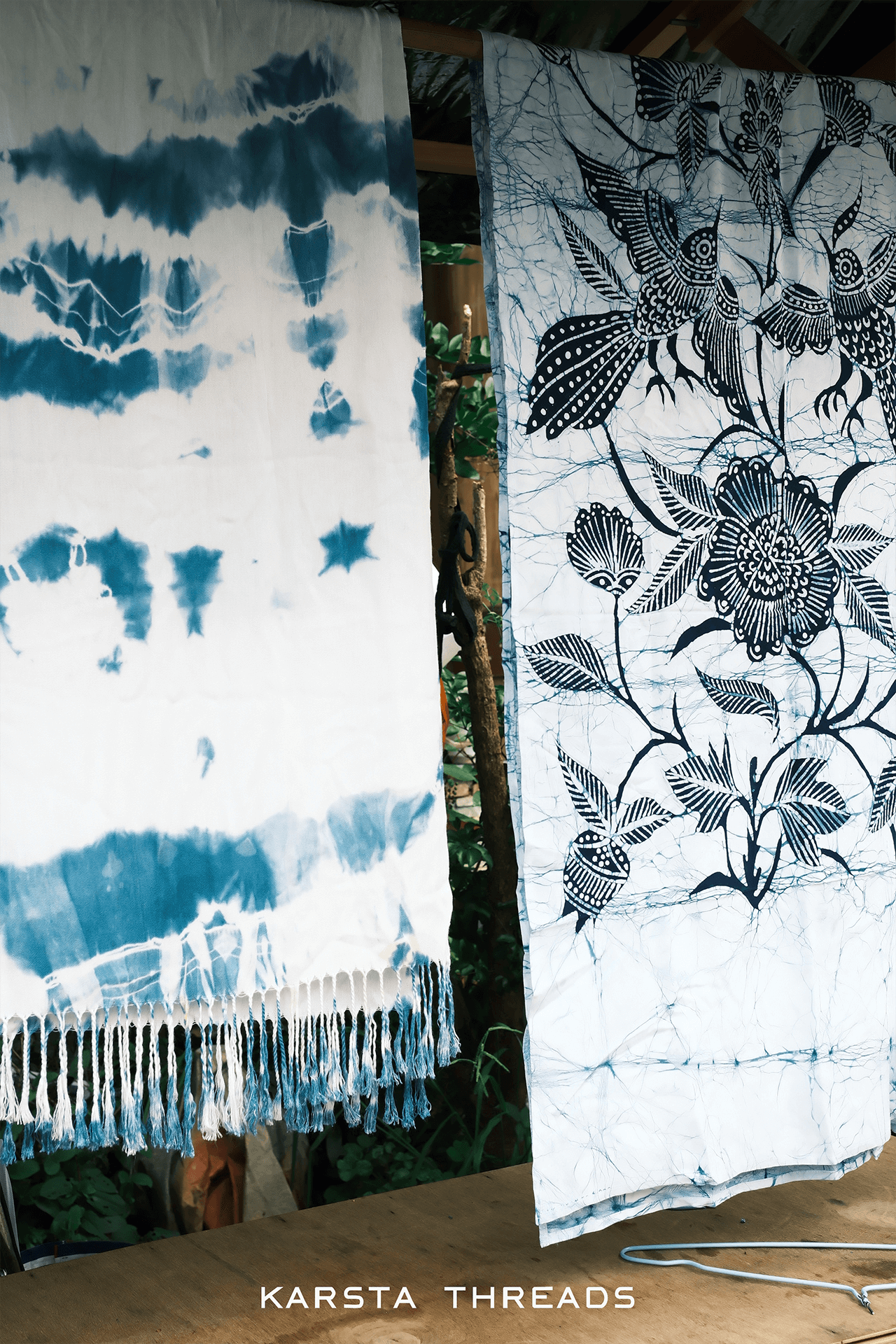 Two pieces of fabric with different patterns hanging side by side, with 'Karsta Threads' branding visible.